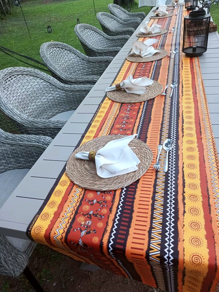 Place settings on an African-print table runner