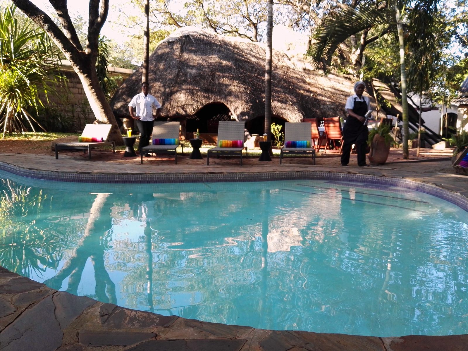 The pool in front of the thatched boma